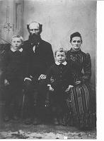  The Sylvestor Mosaly Family, Circa 1904. From left to right are  Charles Mosaly (son), Sylvestor Mosaly, (father), Earl Mosaly (son), and Mary Elizabeth Caroline Speed (mother). Mary Elizabeth Caroline Speed was the sister of Henry Lewis Speed. 

